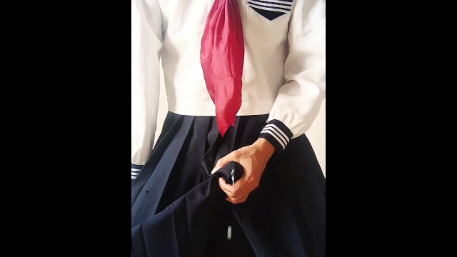 Crossdressing in a sailor suit and ejaculating through the skirt
