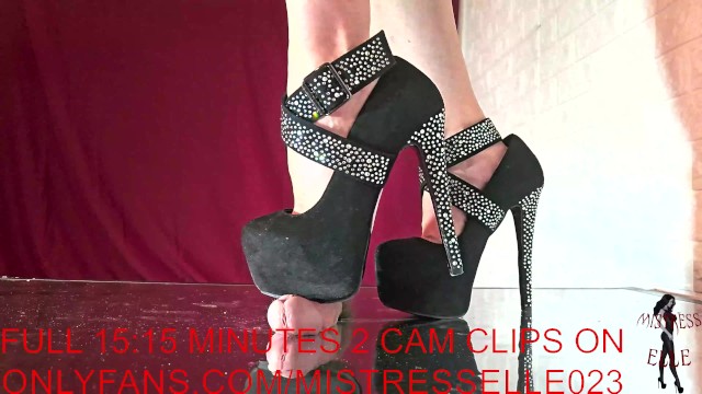 Mistress Elle in her diamond heels reminds her useless slave where he belongs.