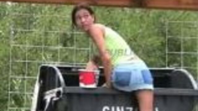 Crazy babe shitting in public waste container