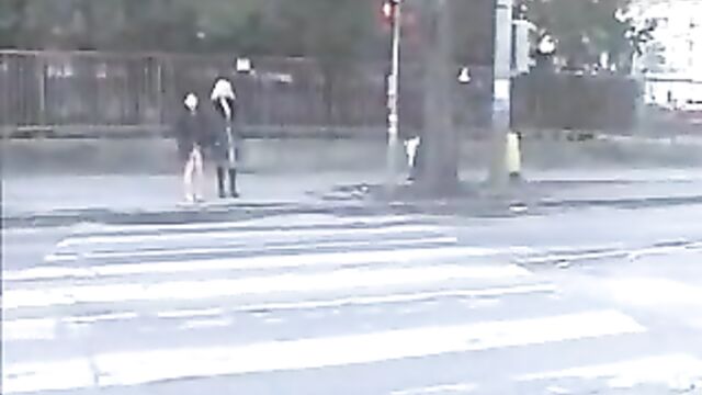 two girls in street piss
